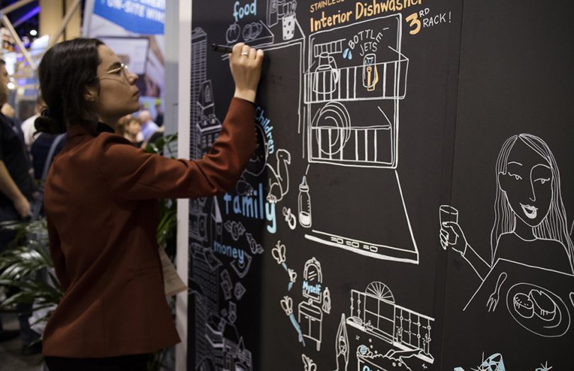 ImageThink graphic recorder creates real-time visuals at a trade show.